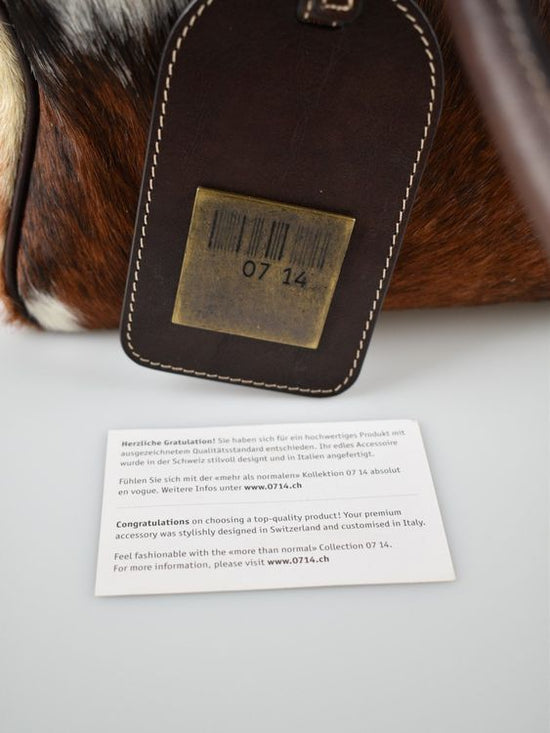 07 14 Schultertasche mit Fell